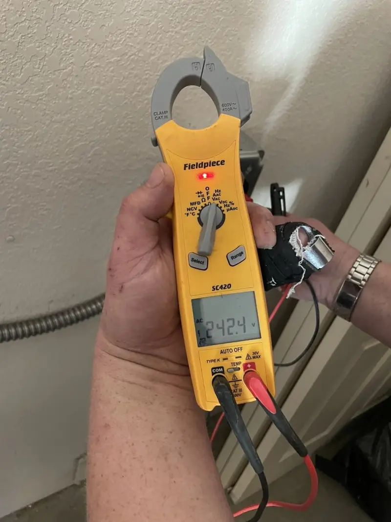 Voltage testing with clamp meter during Generator Installation in Bradley Beach